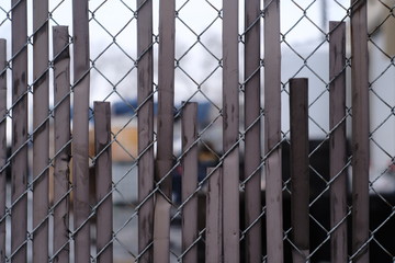 old chainlink fence with metal inserts