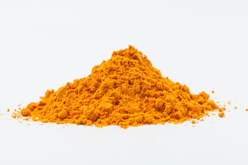 Heap of turmeric. Isolated on white. 