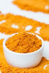 Turmeric in bowl. Selective focus.