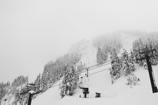 ski lift going into fog