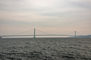 Fototapeta na wymiar View of Akashi Kaikyo Bridge from Okura coast