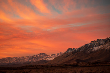 first morning sunlight illuminates snowy mountain peaks in California