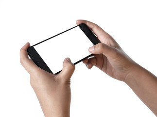 Two hands holding smart phone with blank screen in horizontal orientation and playing video games