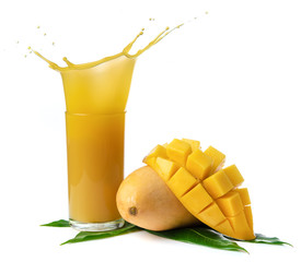 Mango juice splash in a glass with mango slice isolated on white background.