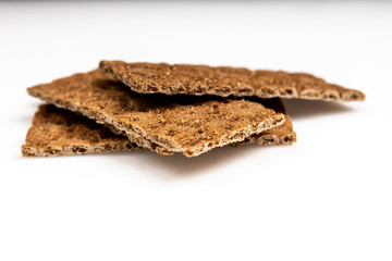 Grain diet light crisp bread lying on a white background