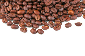 Naklejka premium Dark coffee beans placed on a white scene.