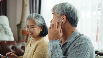 Senior man use wireless earphone to talking with telephone communication
