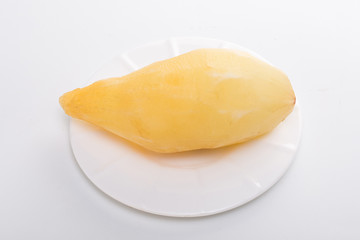 Smallanthus sonchifolius on the white plate, he in the white background, is a nutritional health of the wild plant fruit, pharyngeal inhibition