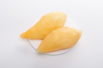 Smallanthus sonchifolius on the white plate, he in the white background, is a nutritional health of the wild plant fruit, pharyngeal inhibition