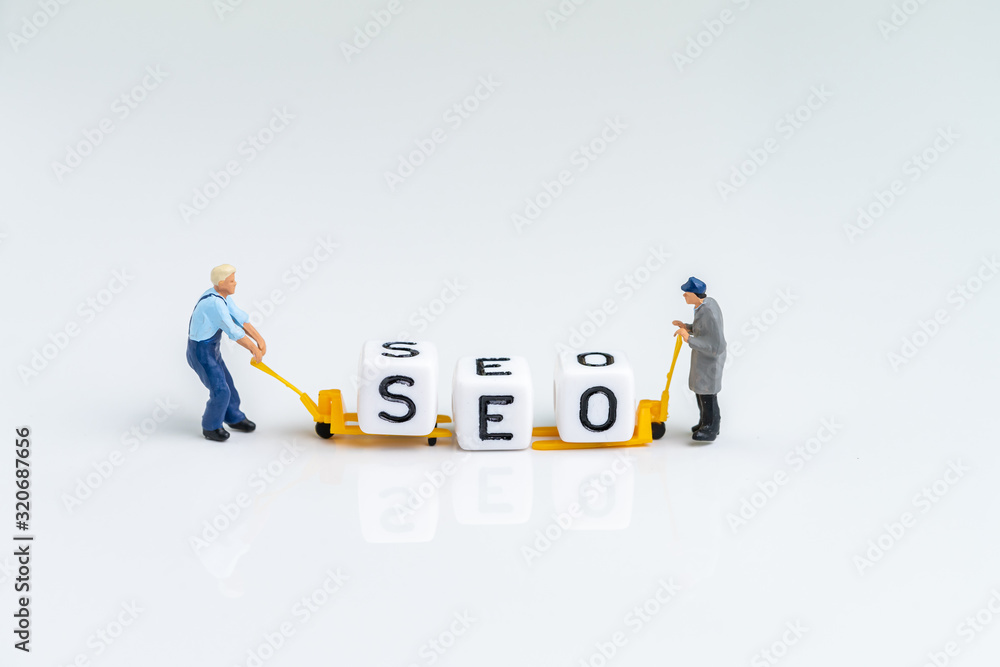 Poster miniature people man pulling forklift with cube small block building the word seo on solid white bac