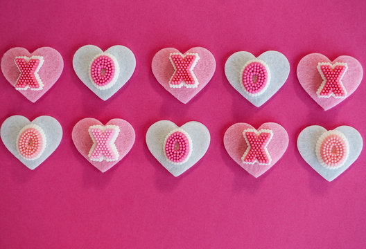 Hearts and hugs, kisses XO symbols Valentines Day design, pink and white
