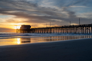 The Newport Beach Pier framed by a beautiful Pacific Sunset 