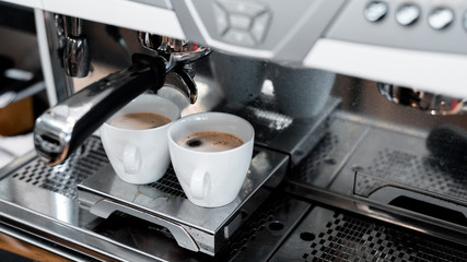 two black coffee morning on coffee maker