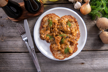 Tasty homemade potato pancakes with meat and mushrooms
