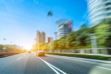 city road through modern buildings in suzhou