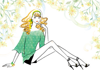 緑のシャツを着た座ったポーズの女性