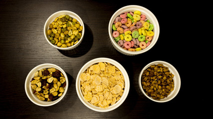 Obraz na płótnie Canvas Healthy food. Peanuts, almonds, cereal in a white bowl