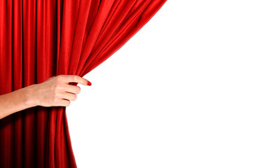 Hand opening red curtain over white background