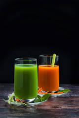 Homemade vegan green juice with vegetables, carrots, celery and herbs. Antioxidant drink