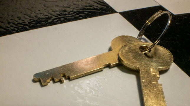 Safe Deposit Box Keys Rest on Desktop