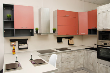modern loft style kitchen with hob, fume hood and table with countertop