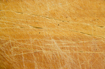 vintage wooden cutboard with knife marks. natural wood texture