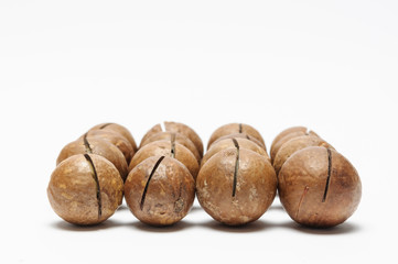 dried Macadamia nuts on white background