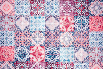 Vintage ceramic tiles wall decoration. Turkish ceramic tiles wall background. Pink tone.