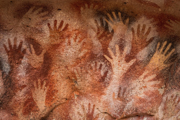 Ancient Cave Paintings of Hands at Cueva de Las Manos in Santa Cruz Province, Patagonia, Argentina - obrazy, fototapety, plakaty