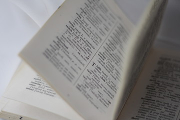 Transcription and translation with the translation of the old dictionary on the background of air...