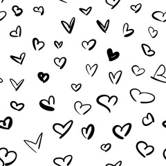 Set of hand-drawn empty black contour hearts isolated on a white background. Seamless pattern can be used as gift wrapping and background for a greeting card.