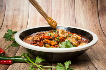This is a famous hot pot dish in Chengdu, Sichuan Province, China. It's made of all kinds of meat and peppers. It's spicy but delicious