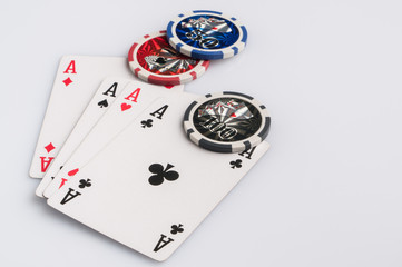 Poker chips and cards on a white background. The concept of gambling and entertainment. Casino and poker