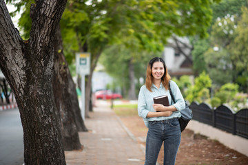 Happy young Asian University student.