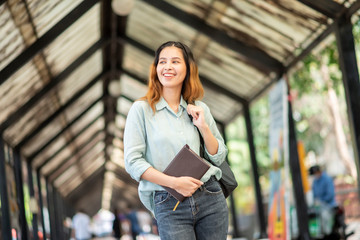 Happy young Asian University student.