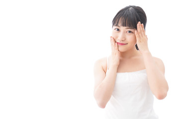 Fototapeta premium フェイシャルケアをする若い女性