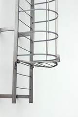 metal fire escape ladder goes up, Emergency stairs, White background, Ladder up the sky outside the building