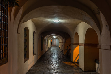 An empty covered arched walk in Prague