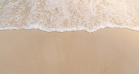 Fototapeta na wymiar Beautiful beach sand with sea wave background