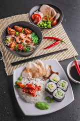 Vertical shot chinese and vietnamese cuisine set. Various of asian assorted dishes on gray background