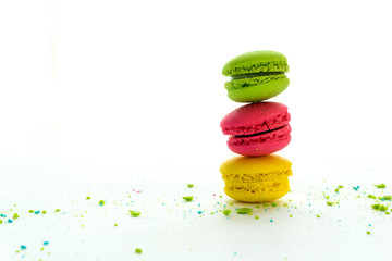 Mixed of Colorful Macarons cake on white background with copy space. Sweet and colorful french macaroons on white background.	