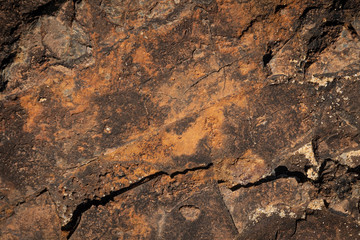 close up of brown and orange rust like stone formation texture background