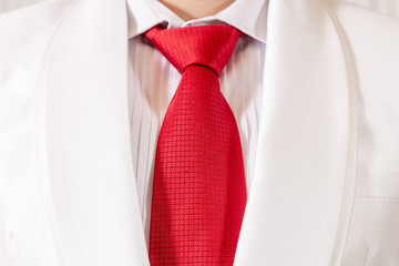 white suit and red necktie background