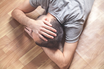 Fototapeta premium Caucasian unconscious man at home.
