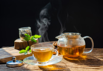  hot tea is poured from the kettle into a kettle with tea leaves redcurrant mandarin orange...