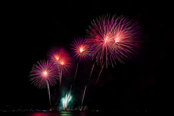 Colorful fireworks of various colors at night with celebration and anniversary concept