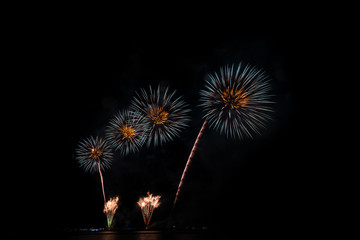 Colorful fireworks of various colors at night with celebration and anniversary concept