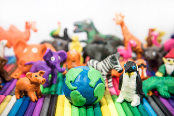 Animals made from Play Clay with Earth Planet in middle.