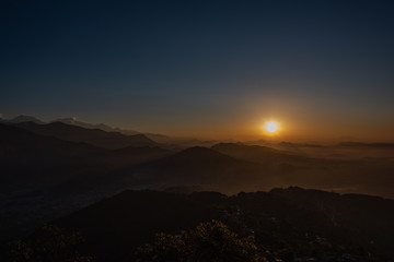 Fototapeta premium Pokhara sunrise at Sarangkot Hill with view of Himalayan mountain range.