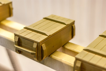 Military style souvenir boxes in paint booth